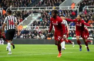 Divock Origi kept Liverpool's title hopes alive with the winner against Newcastle